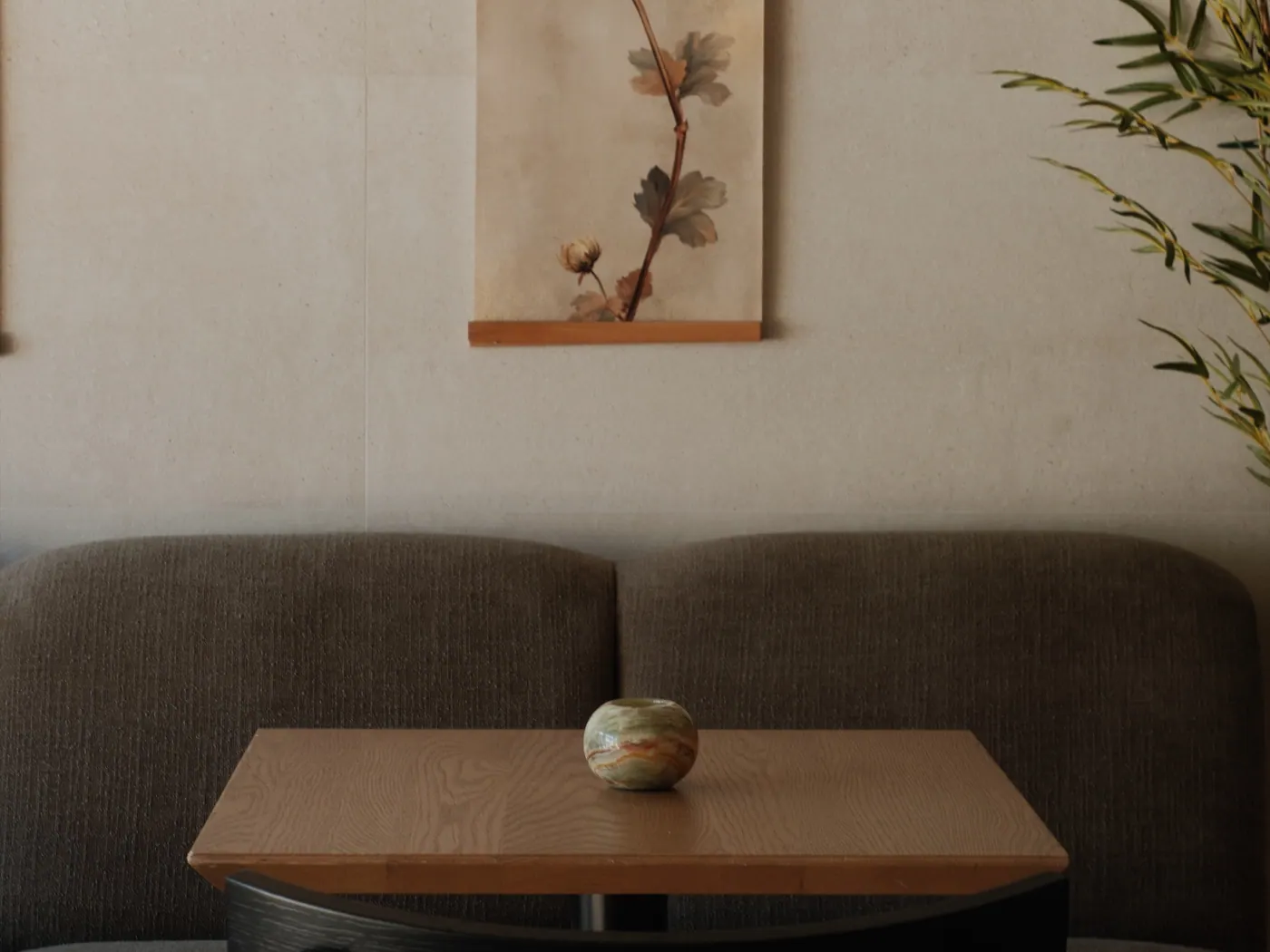 A table in the dining room, a single vase on it